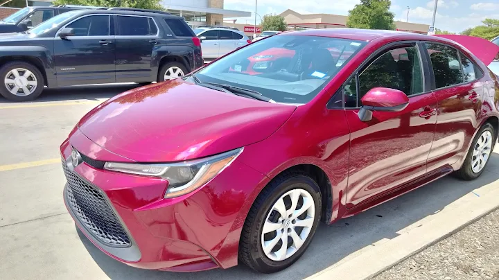 Shiny red Toyota Corolla after professional car wash at Auto Bath