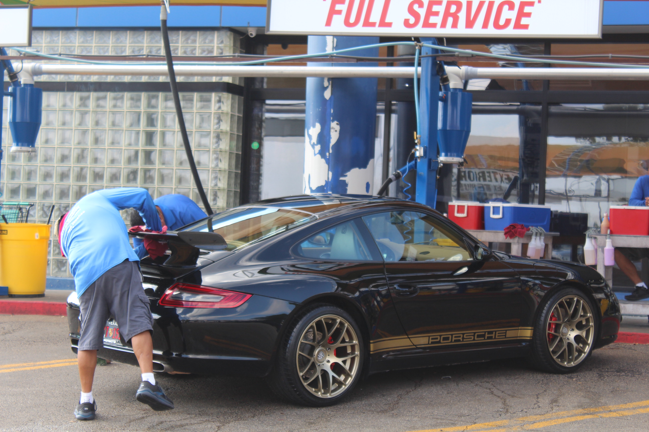 Auto Bath Car Wash team member providing friendly customer service in Arlington, TX