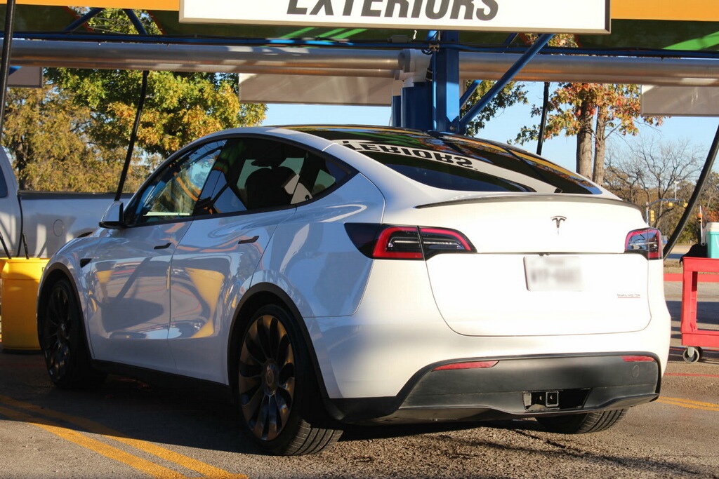 White Tesla at Auto Bath Car Wash vacuum station in Arlington, TX